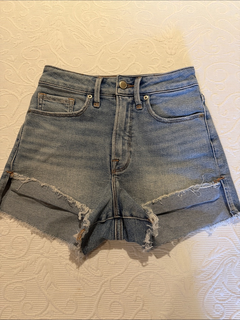 Good American Light Blue High-Rise Distressed Denim Shorts